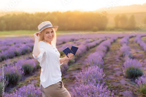 Wallpaper Mural Portrait of a happy smiling woman holding passport in lavender field Torontodigital.ca
