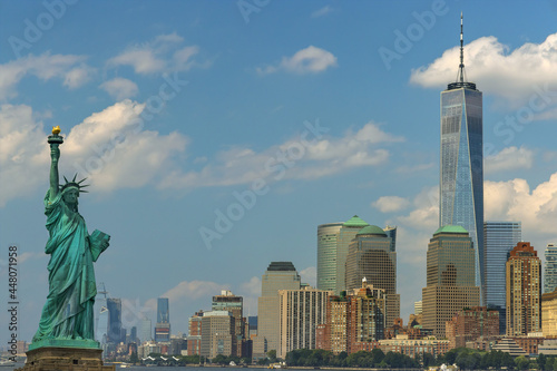 Panorama view of Statue of Liberty with Manhattan downtown skyscraper in lower Manhattan, New York City, USA © ungvar
