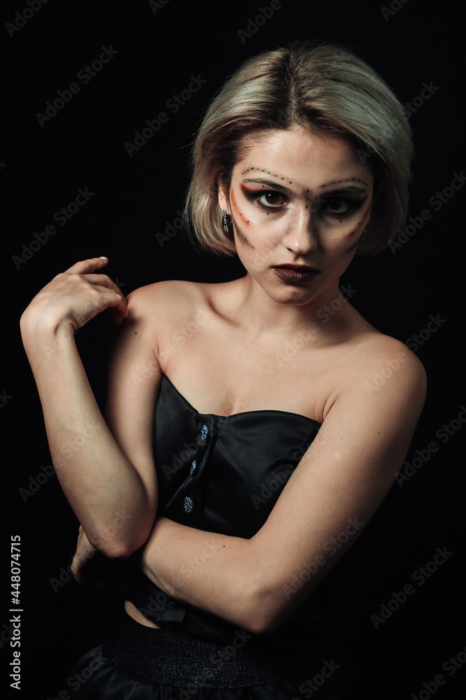Woman portrait on a black background. Girl in black on a dark background Woman portrait on a black background. Girl in black on a dark background