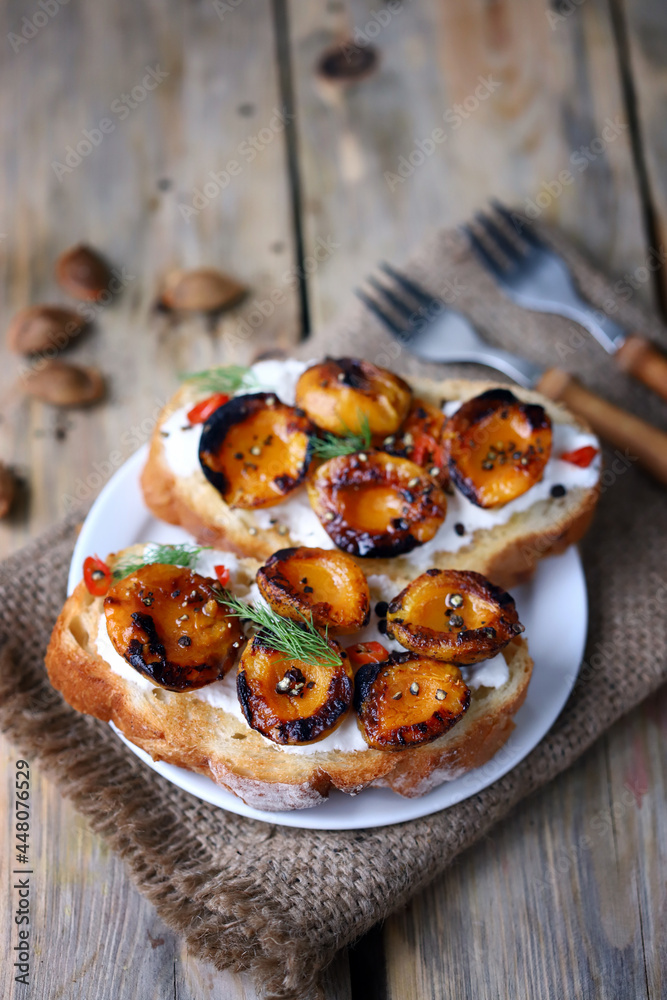 Bruschetta with dried apricots. Healthy sandwiches with apricot and white cheese.