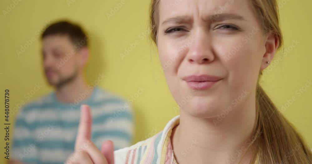 Young gossiping woman on color background