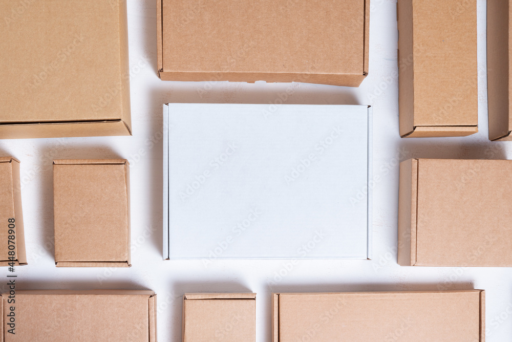 Fototapeta premium Lot of flat brown and white cardboard boxes