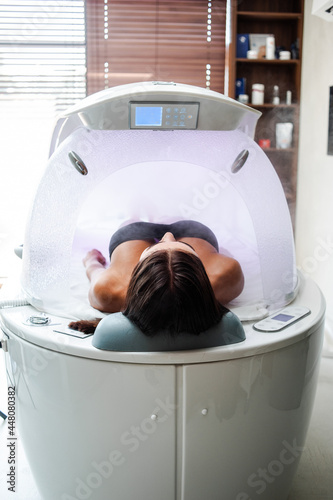 Modern capsule for hydrotherapy in a beauty salon for women 