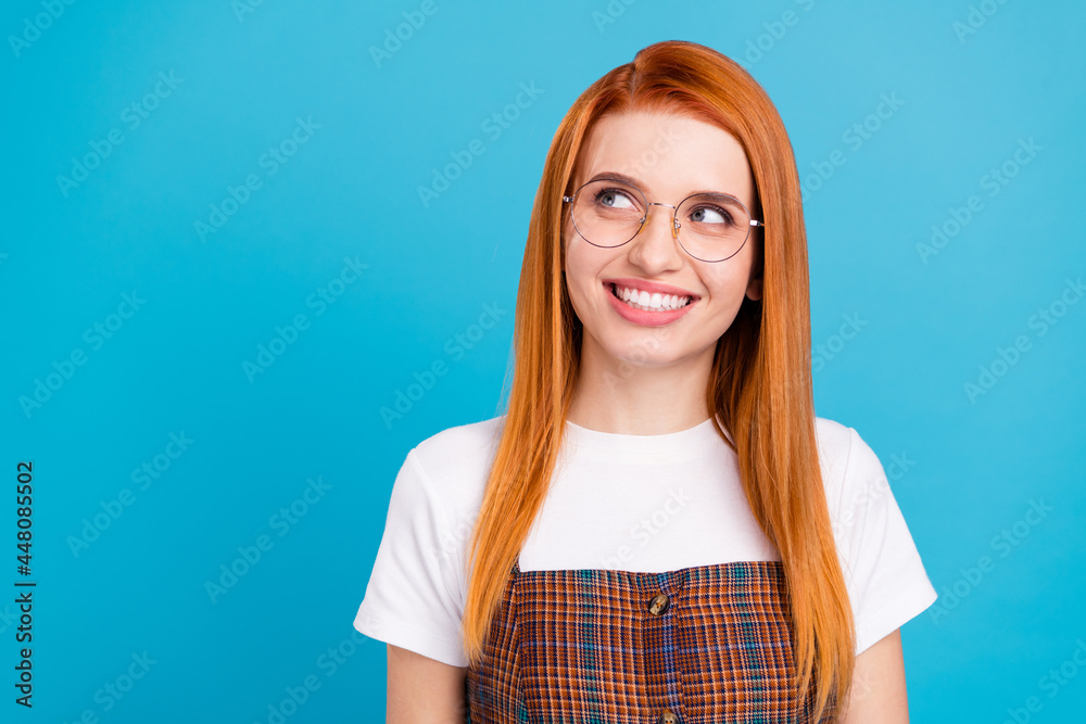 Portrait of attractive cheerful girl overthinking deciding learning copy space isolated over bright blue color background Portrait of attractive cheerful girl overthinking deciding learning copy space isolated over bright blue color background
