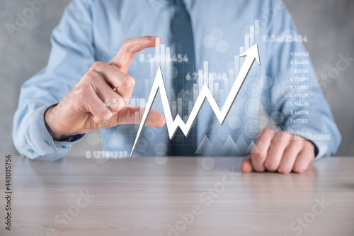 Businessman hold sales data and economic growth graph chart. Business planning and strategy. Analysing trading of exchange. Financial and banking. Technology digital marketing.Profit and growing plan.