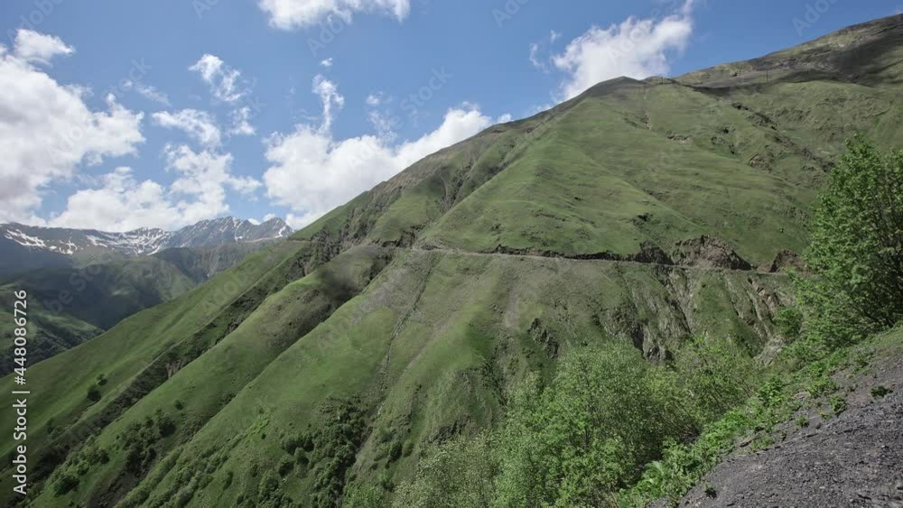 Beautiful mountain landscape. Caucasus mountains with peaks and ridges covered with snow, rocks and cliffs. Beautiful mountain landscape. Caucasus mountains with peaks and ridges covered with snow, rocks and cliffs.