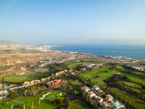 Tenerife, a town on the Atlantic Ocean. Sunny coast and dry soil. Ocean, water, waves, blue ocean.