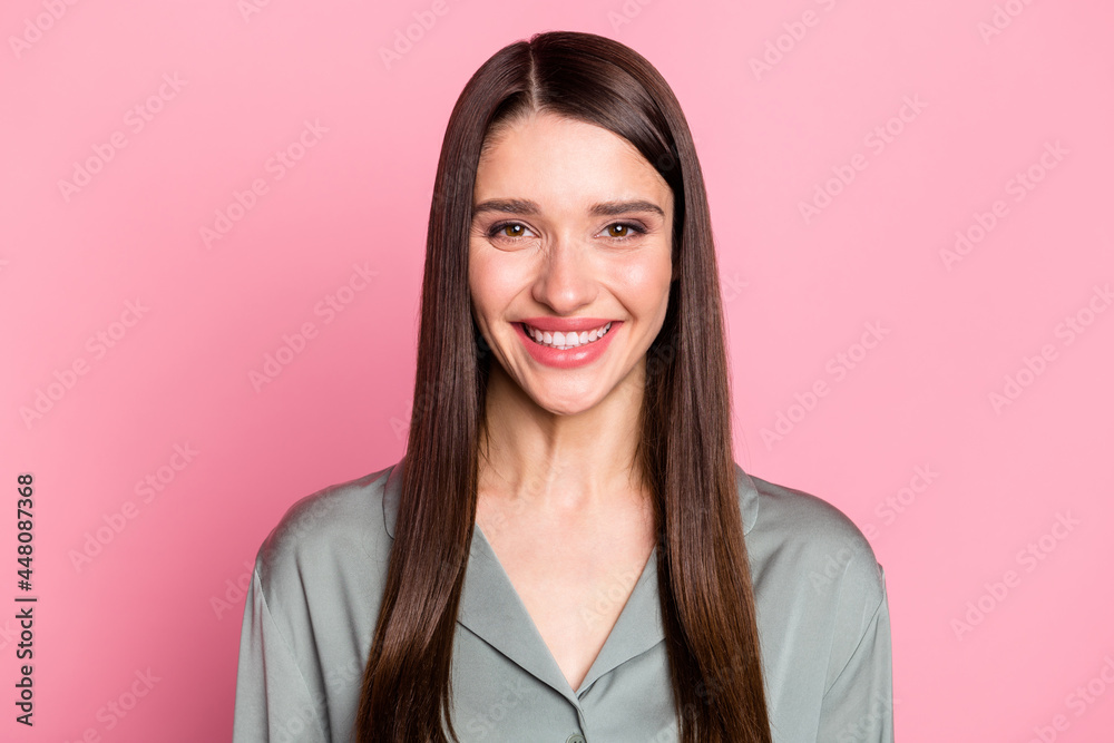 Photo of shiny pretty woman dressed grey outfit smiling isolated pastel pink color background Photo of shiny pretty woman dressed grey outfit smiling isolated pastel pink color background