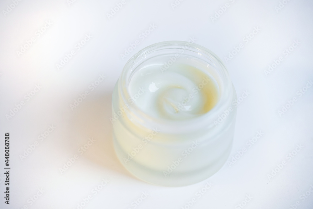 Cream in a jar on a white background Cream in a jar on a white background