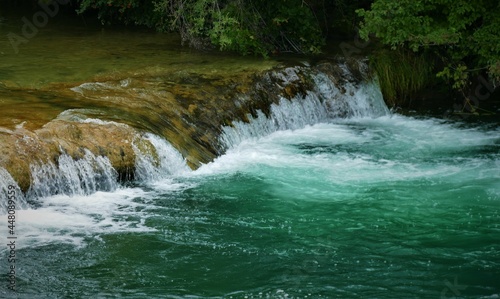 Fototapeta Naklejka Na Ścianę i Meble -  Green clean river with waterfalls nature background