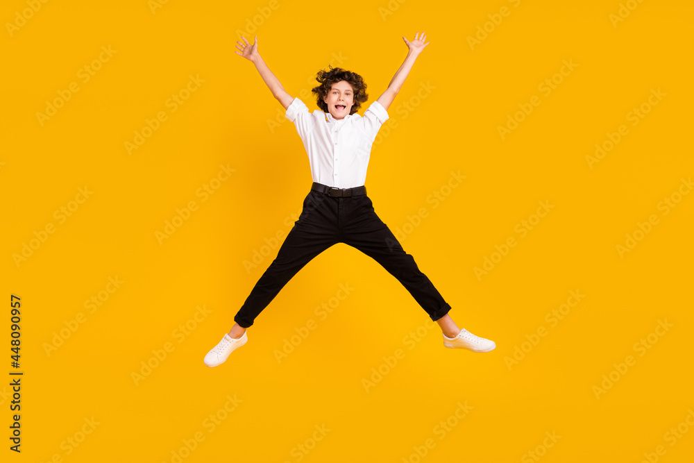 Full body photo of funny little brunet boy jump yell wear uniform shoes isolated on yellow color background
