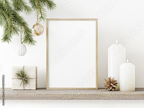 Vertical wooden frame mockup with hanging pine branch, pinecone, star, candles and gift box on rustic rough shelf. Minimal Christmas interior decoration. A4, A3 format. 3d rendering, illustration