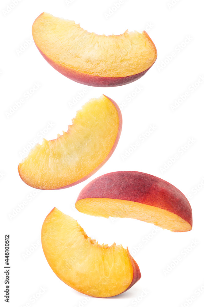 Peach slices falling on a white background, levitating peach. Isolated Peach slices falling on a white background, levitating peach. Isolated