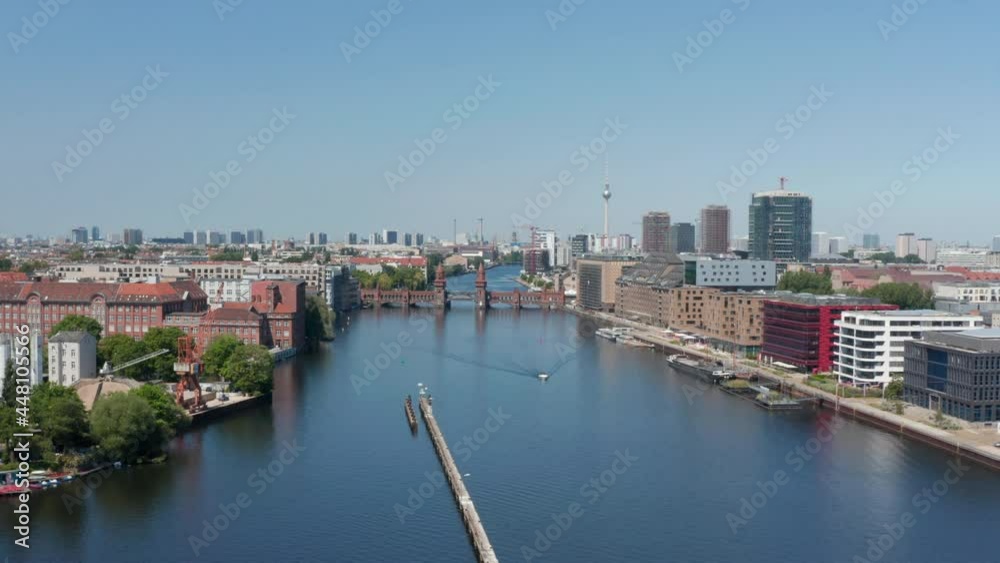 Forwards reveal of double-deck Oberbaum bridge. Old bridge over Spree river. Cityscape with Fernsehturm in background. Berlin, Germany Forwards reveal of double-deck Oberbaum bridge. Old bridge over Spree river. Cityscape with Fernsehturm in background. Berlin, Germany