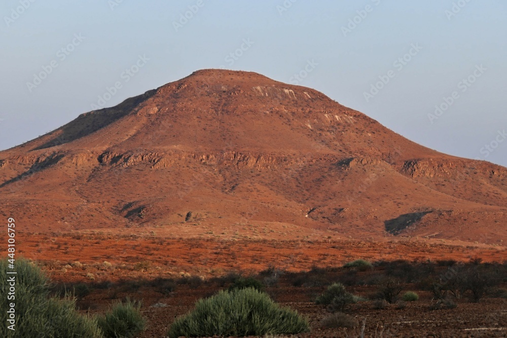 stunning red landscape in the semi desert of namibia, blue sky stunning red landscape in the semi desert of namibia, blue sky