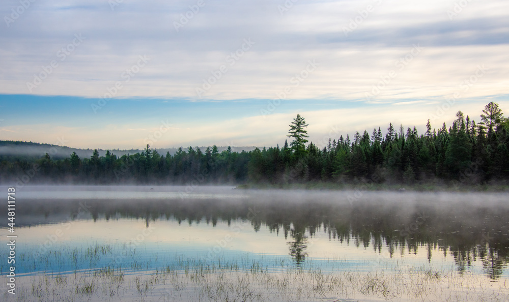 Mist on a great lake in Quebec, Canada in the morning