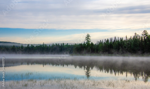 Mist on a great lake in Quebec  Canada in the morning