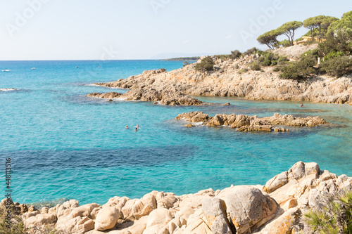 July 23, 2021: crystal clear sea near the beach of granite rocks of Biderosa, Sardinia.