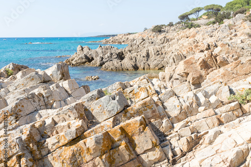 July 23, 2021: crystal clear sea near the beach of granite rocks of Biderosa, Sardinia.