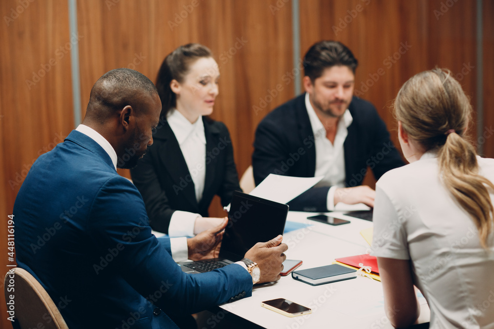 Fototapeta premium Businessman and businesswoman team at office meeting. Business people group conference discussion sit at table with boss man and woman