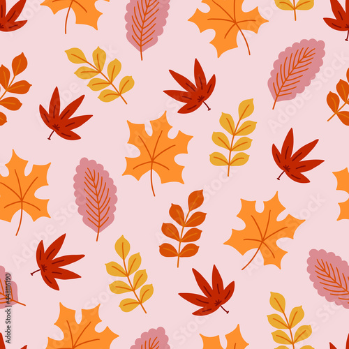 Autumn seamless pattern with colorful leaves on pink background