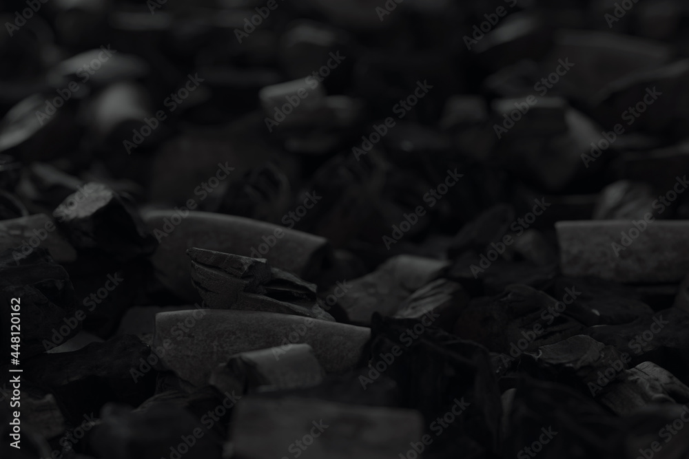 3d rendering of charcoals laying on floor. Selective focus