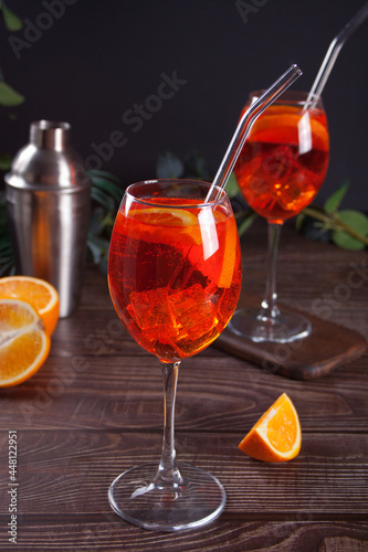Aperol Spritz Italian cocktail alcoholic beverage with ice cubes and oranges.