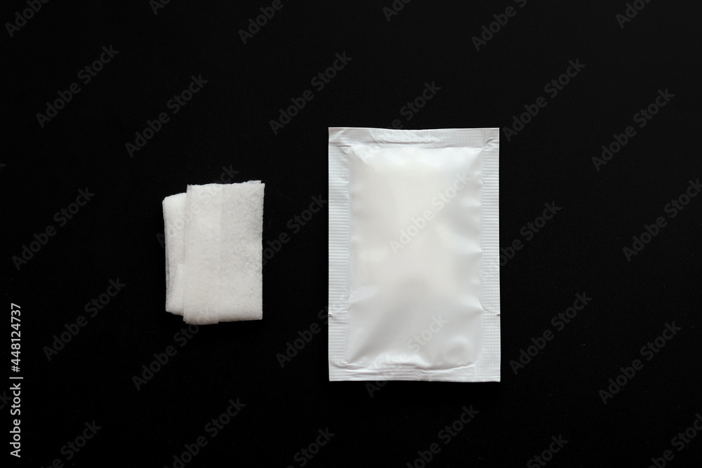 Blank white sachet packets stack mockup isolated on black background