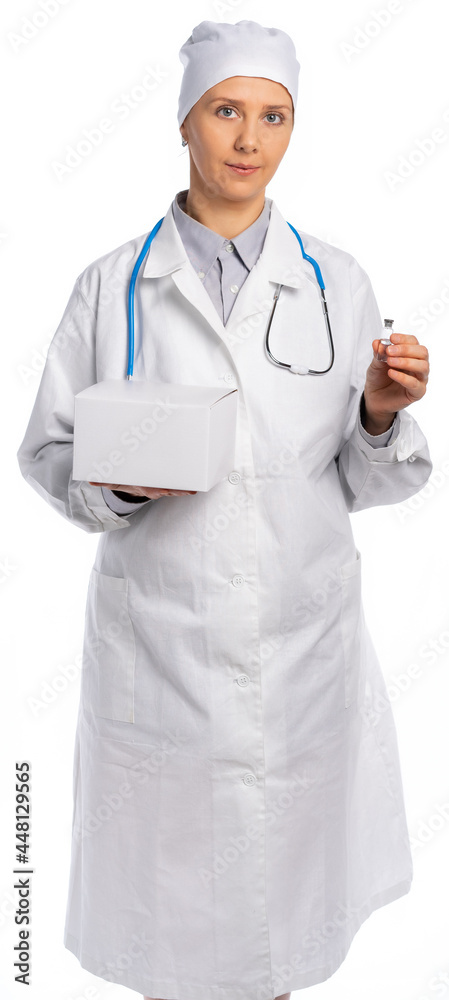 female doctor in a white coat and hat. a medic holds a white box and a vial with a vaccine, medicine. vaccination of the population. white background, isolated female doctor in a white coat and hat. a medic holds a white box and a vial with a vaccine, medicine. vaccination of the population. white background, isolated