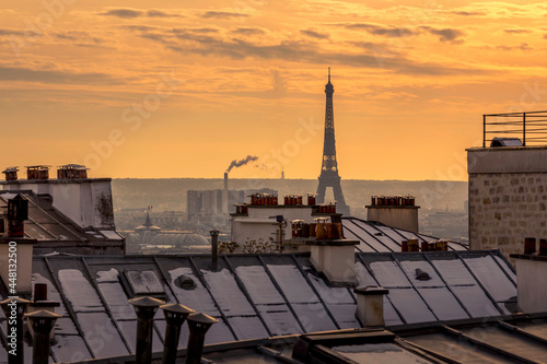 Paris, France - February 11, 2021: Iconic Eiffel tower viewed from Monmartre district in Paris in a snowy day