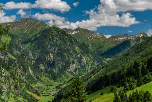 Summer valley with Grossarler Ache small river and blue cloudy sky © luzkovyvagon.cz