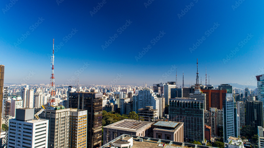 Naklejka premium Aerial view of Av. Paulista in São Paulo, SP. Main avenue of the capital. Sunday day, without cars, with people walking on the street