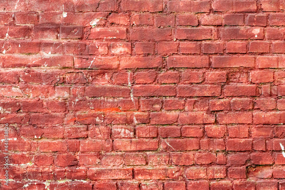 Texture of a brick wall with cracks and scratches which can be used as a background Texture of a brick wall with cracks and scratches which can be used as a background