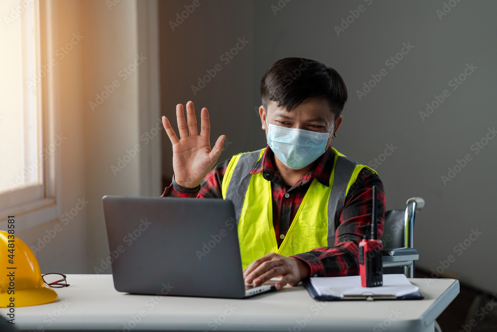 People with disabilities working as engineers are doing video call meeting greetings People with disabilities working as engineers are doing video call meeting greetings