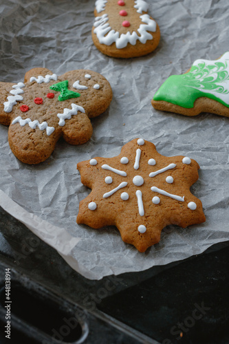 christmas gingerbread cookies on a baking tray. Snowflake, gingerbread man. 