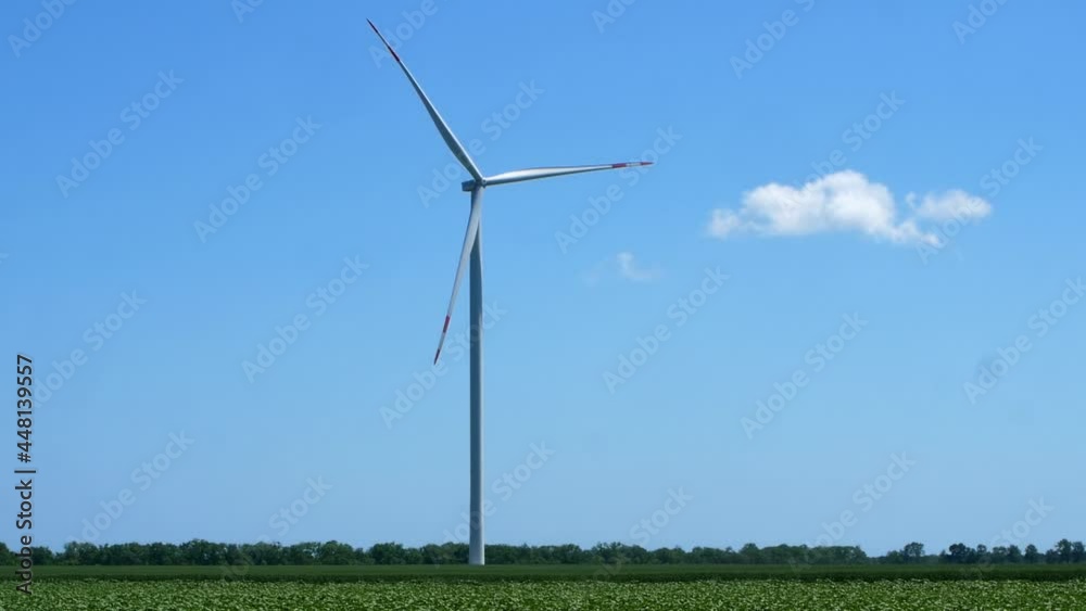 Electric windmill with long blades close-up. Wind turbine for the production of electricity. Electric windmill with long blades close-up. Wind turbine for the production of electricity.