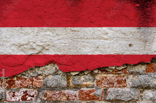 Graphic Concept with a Flag of Austria painted on a damaged brick wall.