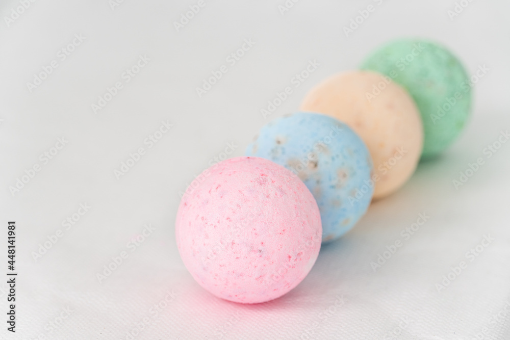 bathroom bombs green, pink, cream and blue on a white background bathroom bombs green, pink, cream and blue on a white background