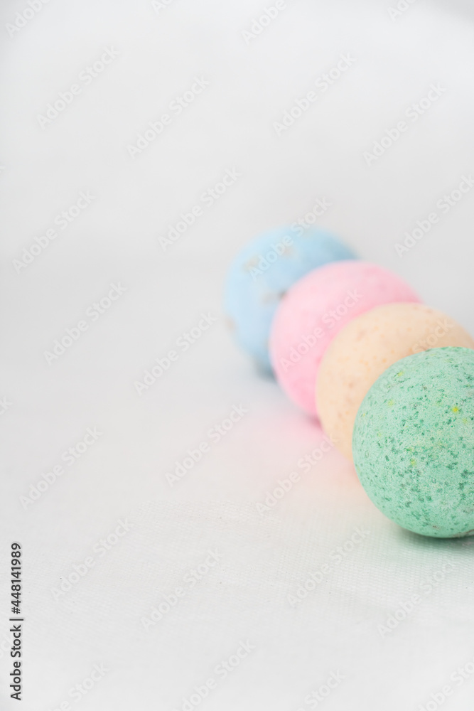 bathroom bombs green, pink, cream and blue on a white background bathroom bombs green, pink, cream and blue on a white background