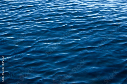 Light ripples on the deep blue water. Waves on the sea.Background.