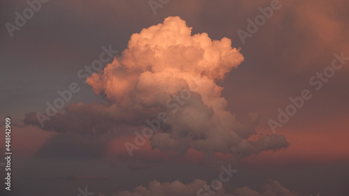 a colorful cloud cluster and a gray sunset in the sky