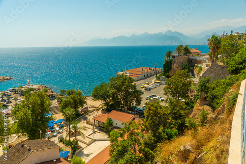 ANTALYA, TURKEY: Top view of the old town, the sea and the mountains on a sunny summer day in Antalya.