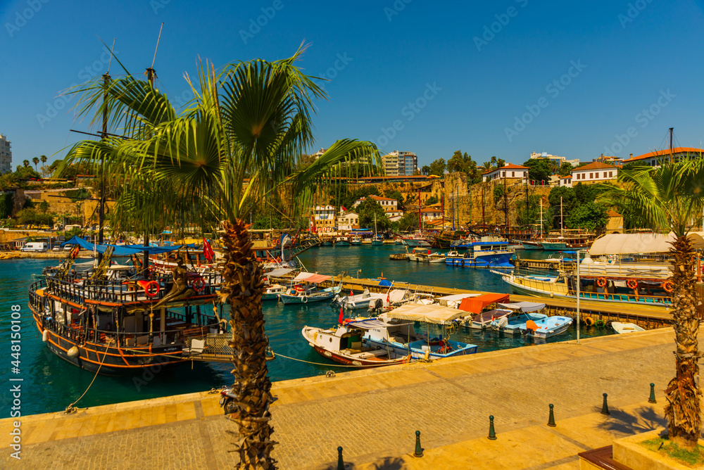 ANTALYA, TURKEY: The old harbor in Antalya and the port with ships and boats on a sunny summer day.