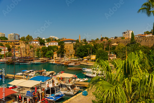 ANTALYA, TURKEY: The old harbor in Antalya and the port with ships and boats on a sunny summer day.
