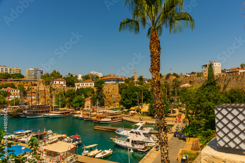 ANTALYA, TURKEY: The old harbor in Antalya and the port with ships and boats on a sunny summer day.