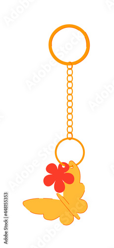 Keychain with gold butterfly and red flower pendant isolated