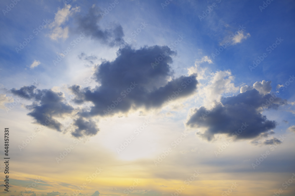 Sunset with dark clouds on the blue sky Sunset with dark clouds on the blue sky