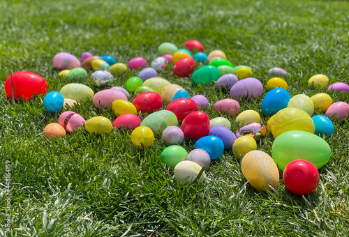 Multicolored Easter eggs on grass photo