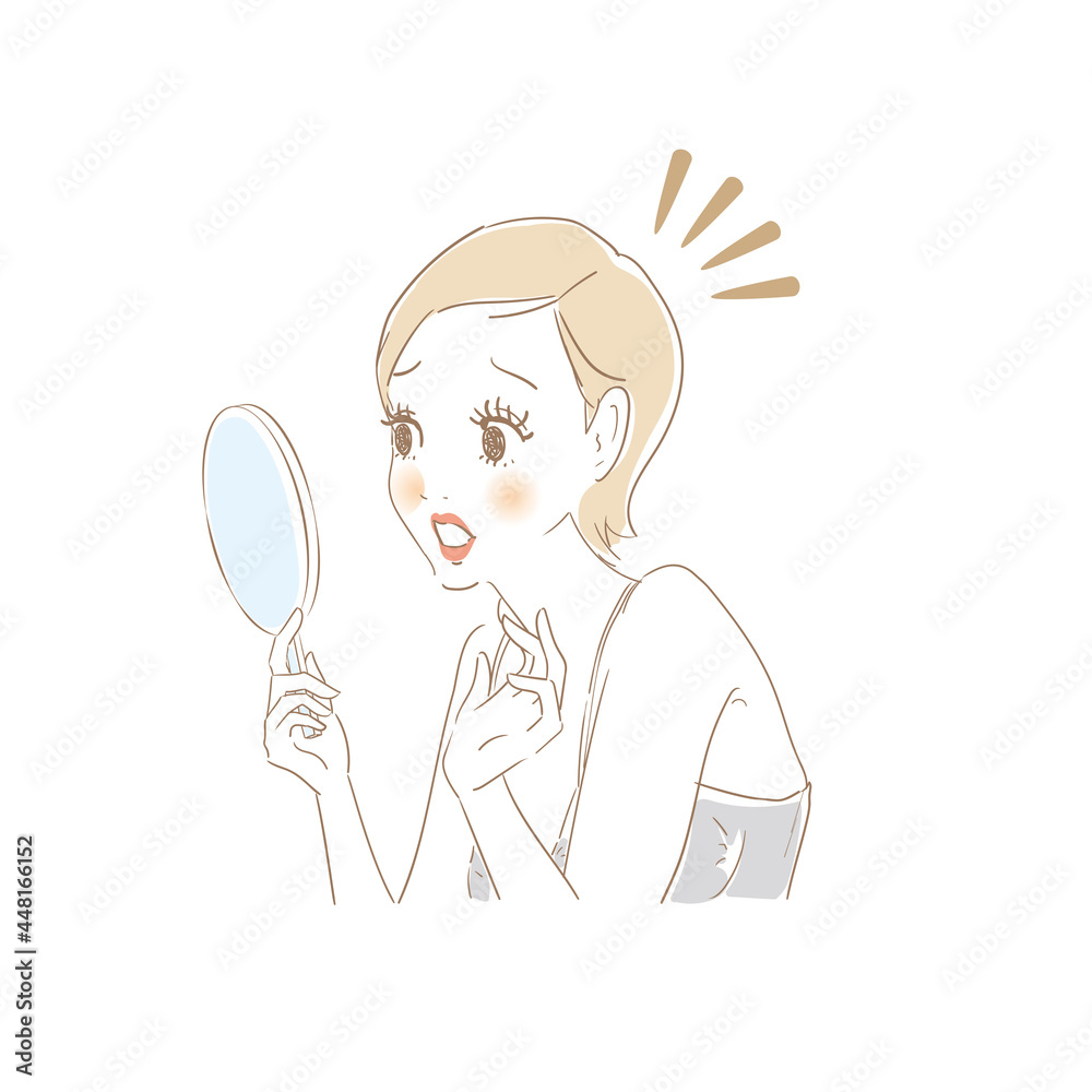 鏡でお肌をチェックする女性