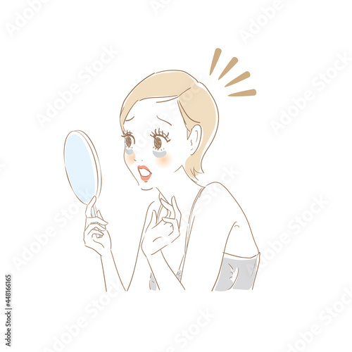 鏡でお肌をチェックする女性